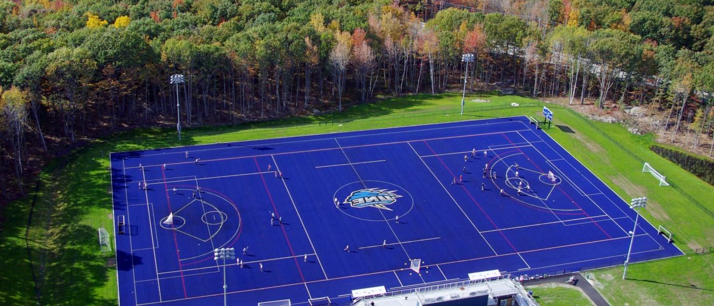 Aerial view of U N E's blue turf field